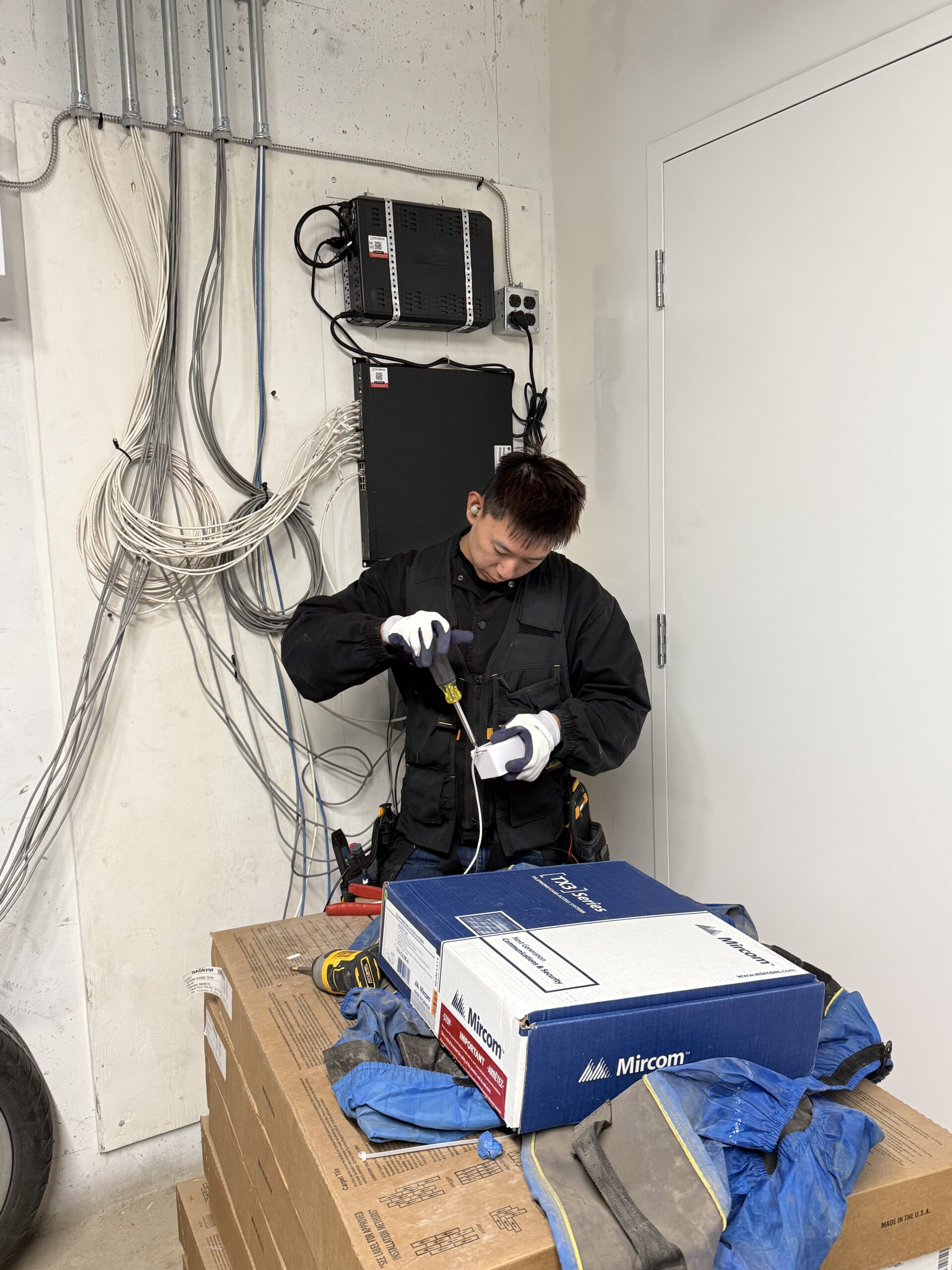 Technician terminating low-voltage connections